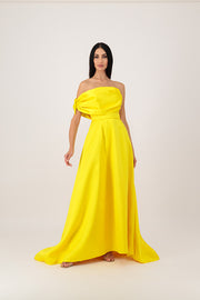 A yellow corset dress with embroidery on the sleeves.